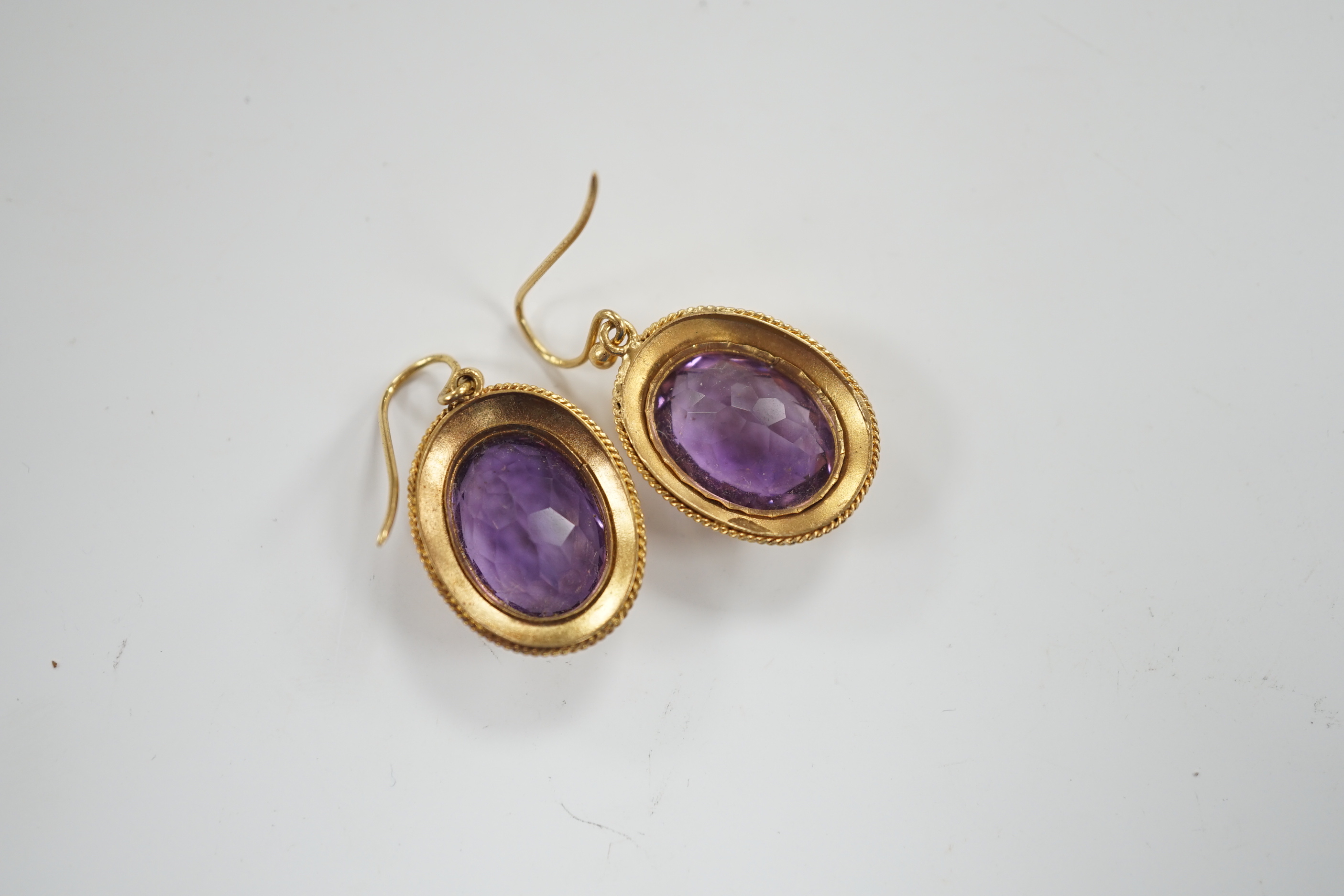 A pair of Victorian yellow metal and amethyst set oval drop earrings, 21mm, gross weight 6.3 grams.